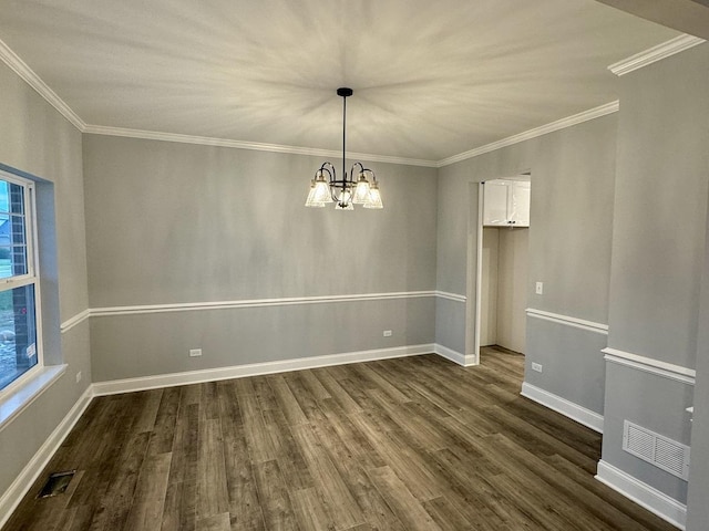 unfurnished room featuring plenty of natural light, visible vents, an inviting chandelier, and dark wood-type flooring