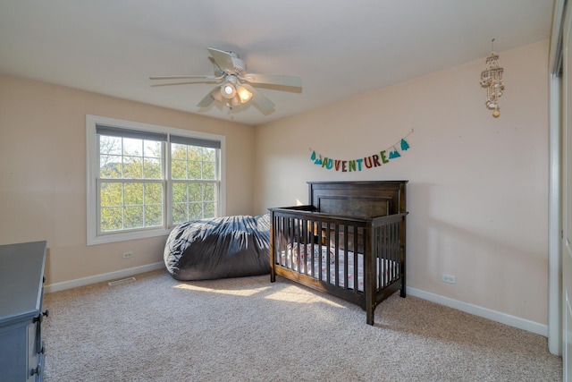 carpeted bedroom with baseboards and ceiling fan