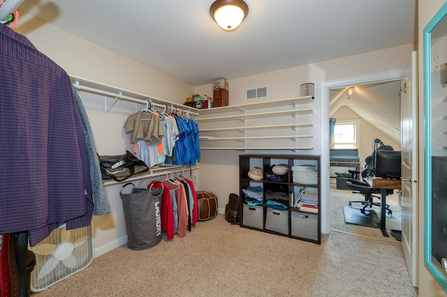 spacious closet with carpet floors
