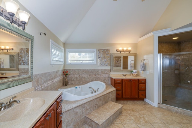 bathroom with vaulted ceiling, a chandelier, a shower stall, a garden tub, and tile patterned floors