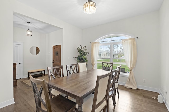 4220 166th Ln, Lowell, IN 46356 - dining area featuring baseboards, wood finished floors, and a notable chandelier