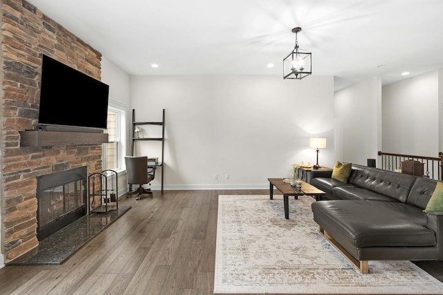 4220 166th Ln, Lowell, IN 46356 - living area featuring recessed lighting, baseboards, wood finished floors, and a fireplace