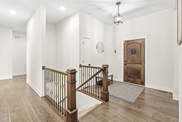 4220 166th Ln, Lowell, IN 46356 - foyer entrance with baseboards, visible vents, and wood finished floors