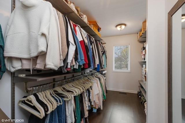spacious closet featuring visible vents and wood finished floors