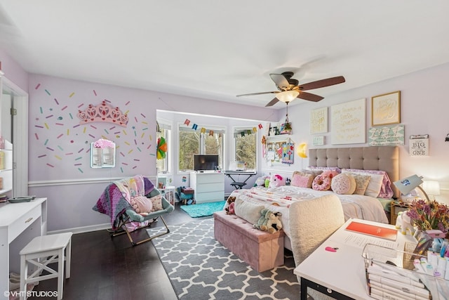 bedroom with wood-type flooring and a ceiling fan