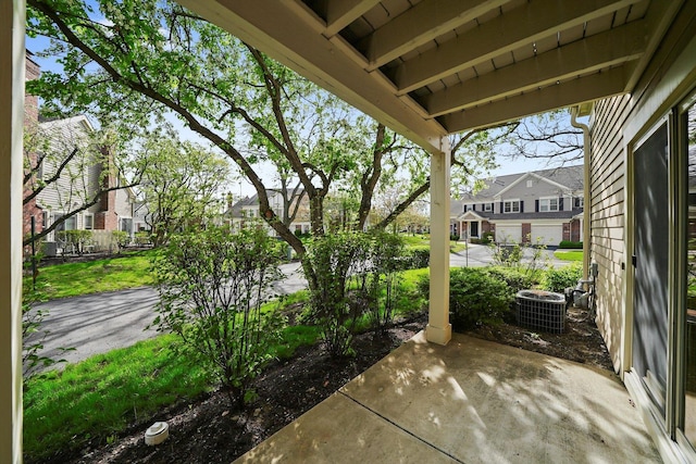 view of patio featuring central AC unit and a residential view