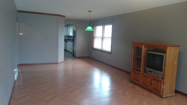 615 Price Ave, Calumet City, IL 60409 - unfurnished living room with arched walkways and baseboards