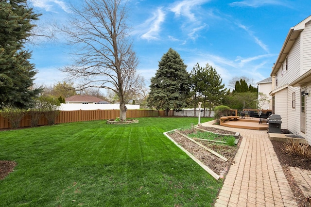205 Northampton Dr, Oswego, IL 60543 - view of yard with a fenced backyard and a wooden deck