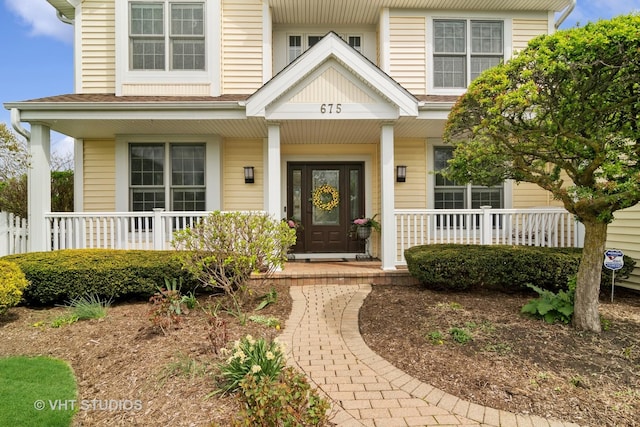 property entrance featuring covered porch