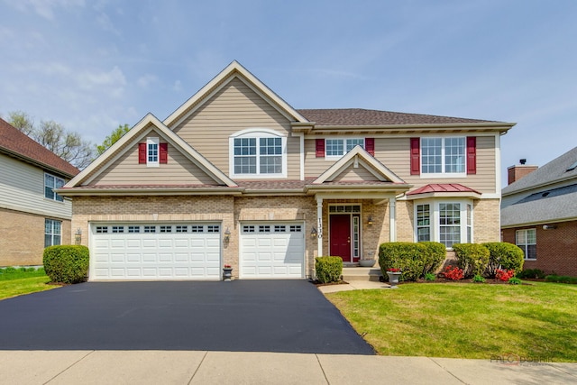 1330 Horizon Trl, Wheeling, IL 60090 - traditional home with brick siding, a garage, driveway, and a front yard