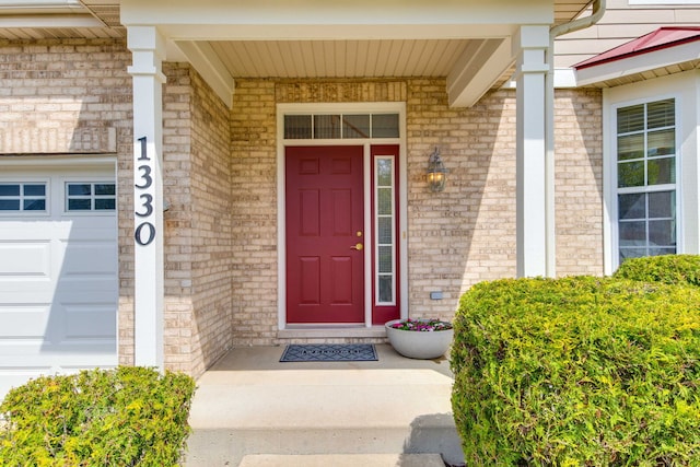 1330 Horizon Trl, Wheeling, IL 60090 - view of exterior entry featuring brick siding and a garage