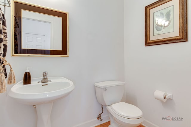 1330 Horizon Trl, Wheeling, IL 60090 - half bathroom featuring toilet, baseboards, and a sink