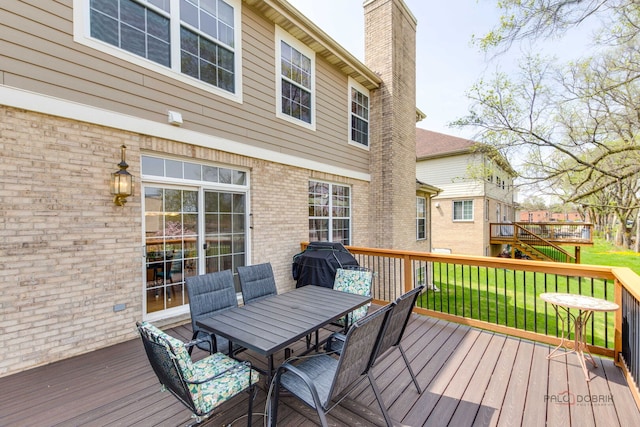 1330 Horizon Trl, Wheeling, IL 60090 - wooden deck with outdoor dining area, a yard, and area for grilling