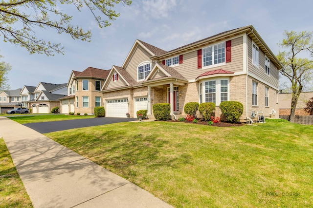 1330 Horizon Trl, Wheeling, IL 60090 - view of front of property with brick siding, a front lawn, aphalt driveway, and a residential view