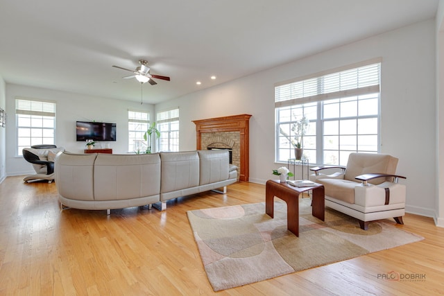 1330 Horizon Trl, Wheeling, IL 60090 - living room with light wood-style floors, a fireplace, a ceiling fan, and a wealth of natural light
