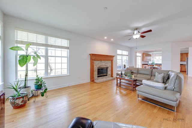 1330 Horizon Trl, Wheeling, IL 60090 - living area with ceiling fan, baseboards, a glass covered fireplace, light wood-style floors, and recessed lighting