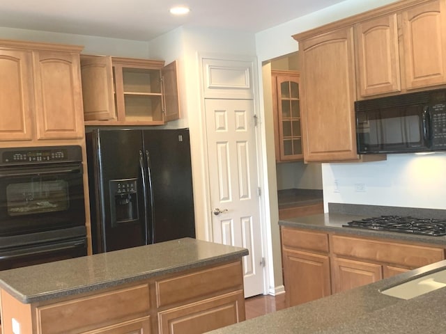 644 Tuscan Vw, Elgin, IL 60124 - kitchen featuring black appliances, dark countertops, glass insert cabinets, recessed lighting, and a sink