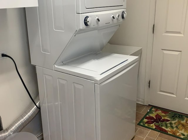644 Tuscan Vw, Elgin, IL 60124 - laundry room with stacked washer and clothes dryer and tile patterned flooring