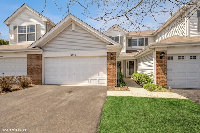 3095 Courtland St Unit 0, Woodstock, IL 60098 - multi unit property featuring concrete driveway, brick siding, and a garage