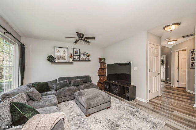 3095 Courtland St Unit 0, Woodstock, IL 60098 - living room featuring visible vents, a ceiling fan, baseboards, and wood finished floors