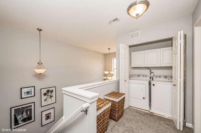 3095 Courtland St Unit 0, Woodstock, IL 60098 - clothes washing area featuring cabinet space, separate washer and dryer, light colored carpet, and visible vents
