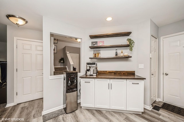 3095 Courtland St Unit 0, Woodstock, IL 60098 - bar featuring a bar, recessed lighting, light wood finished floors, and baseboards
