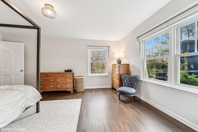 1404 Lincoln St, Evanston, IL 60201 - bedroom with baseboards and dark wood-style flooring