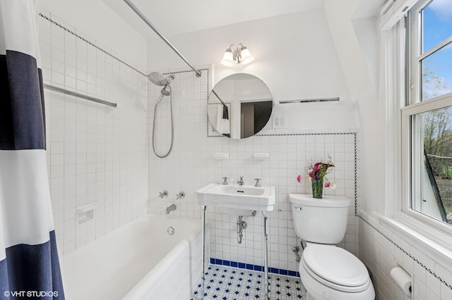 1404 Lincoln St, Evanston, IL 60201 - bathroom with tile walls, tile patterned floors, shower / bath combination with curtain, and toilet