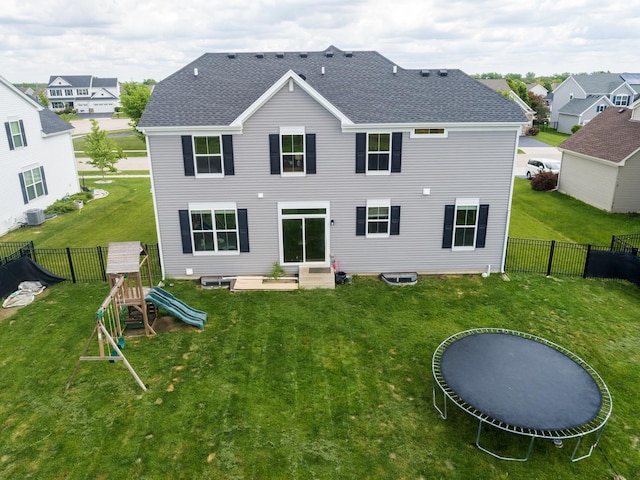 9303 Enstrom Ln, Huntley, IL 60142 - rear view of property with a shingled roof, a fenced backyard, a playground, and entry steps