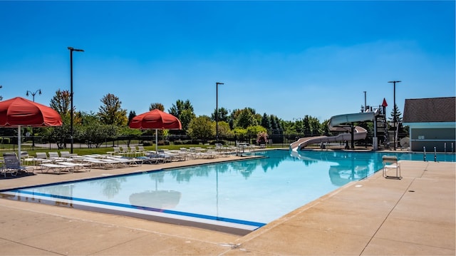 9303 Enstrom Ln, Huntley, IL 60142 - community pool with a water slide and a patio
