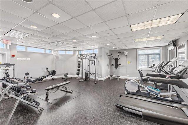 9303 Enstrom Ln, Huntley, IL 60142 - gym with a paneled ceiling