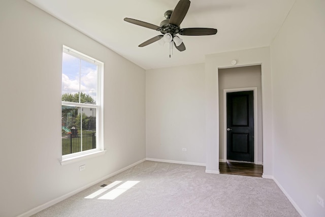 9303 Enstrom Ln, Huntley, IL 60142 - carpeted empty room with baseboards and ceiling fan