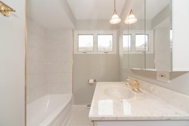 full bath with baseboards, a healthy amount of sunlight, tile patterned floors, and vanity