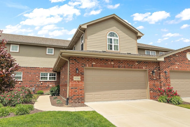 9356 Parkwood Ln, Tinley Park, IL 60487 - traditional home featuring brick siding, a garage, and driveway