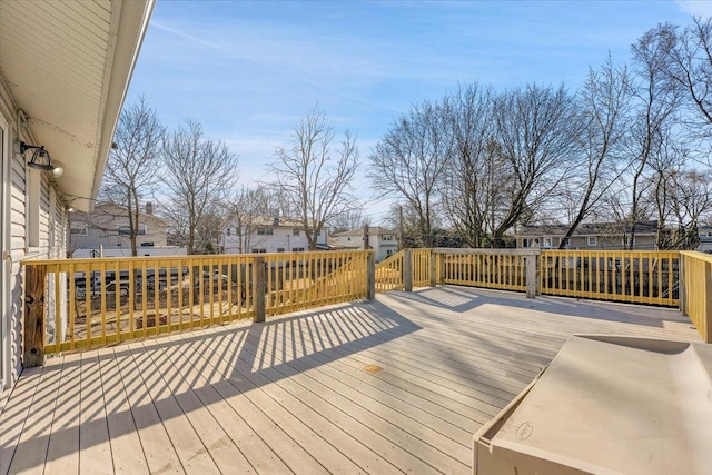 wooden terrace with a residential view
