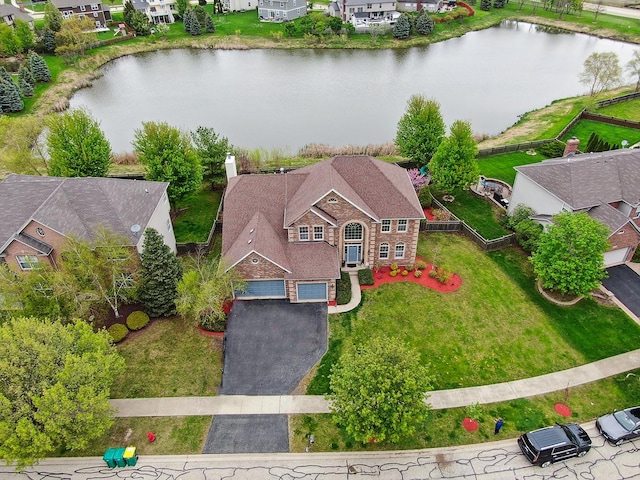 aerial view with a residential view and a water view