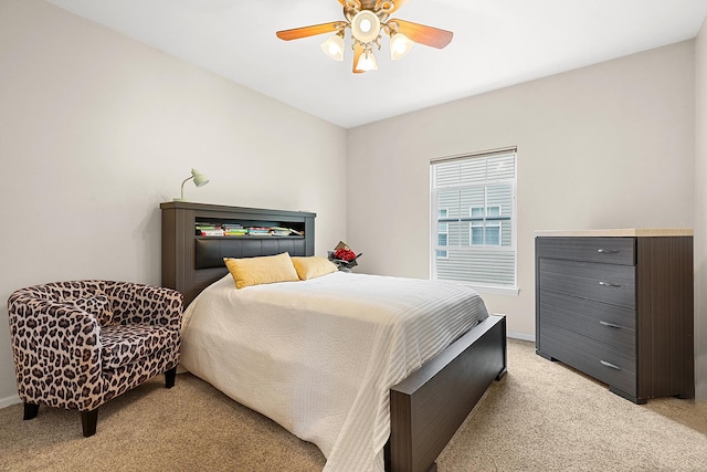 bedroom with baseboards, light carpet, and a ceiling fan