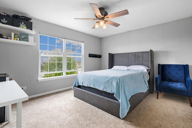 bedroom with baseboards, a ceiling fan, and carpet flooring