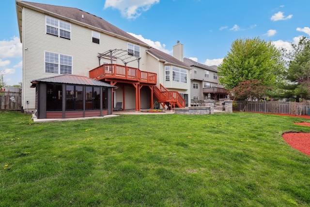 back of house with fence, a pergola, a gazebo, and a wooden deck