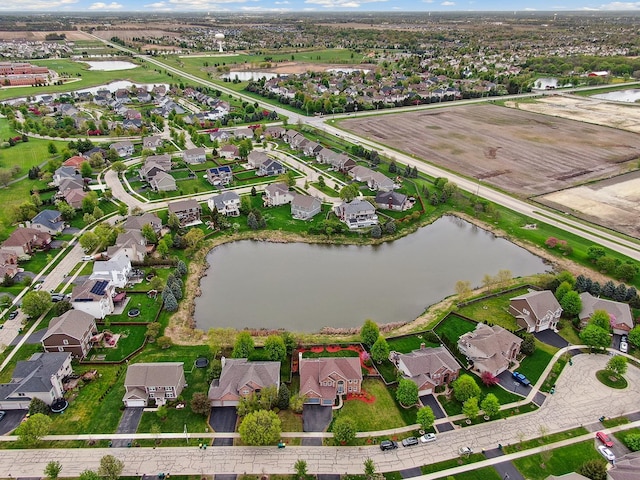 aerial view with a residential view and a water view