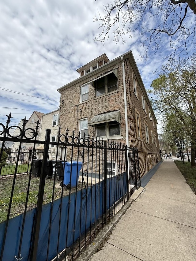 view of gate featuring a fenced front yard
