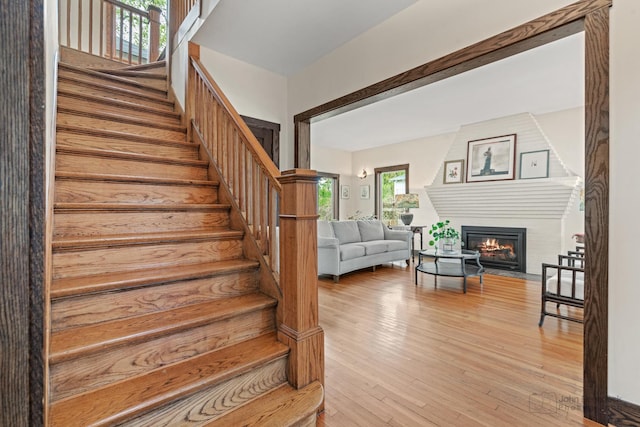 9515 S Damen Ave, Chicago, IL 60643 - stairway featuring a glass covered fireplace and wood finished floors