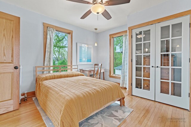 9515 S Damen Ave, Chicago, IL 60643 - bedroom with ceiling fan, multiple windows, french doors, and light wood-style flooring