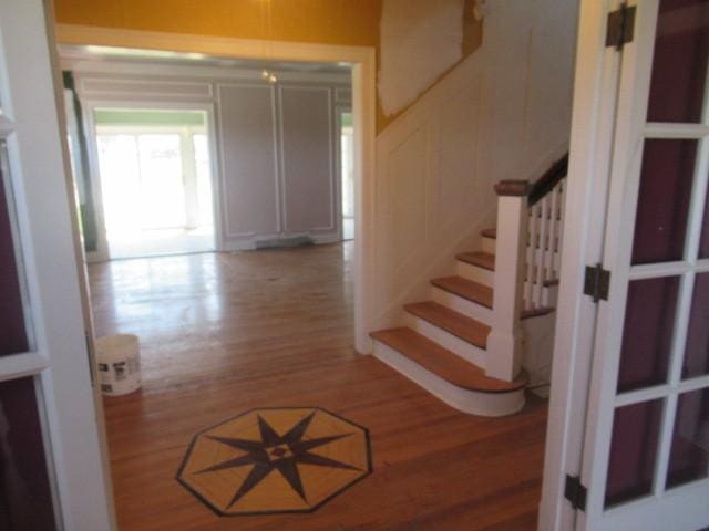 stairway featuring wood finished floors