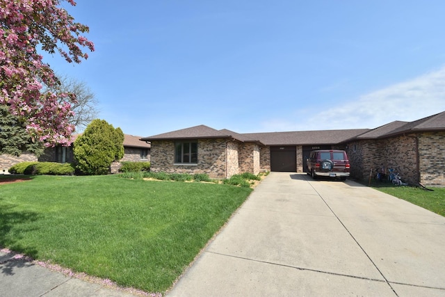 ranch-style house with brick siding, driveway, a front yard, and a garage