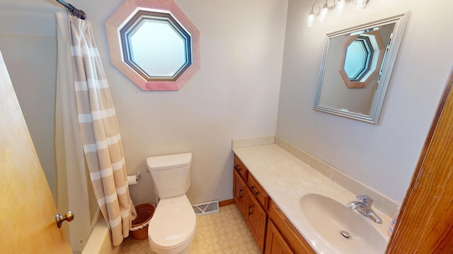 full bathroom with vanity, toilet, and visible vents