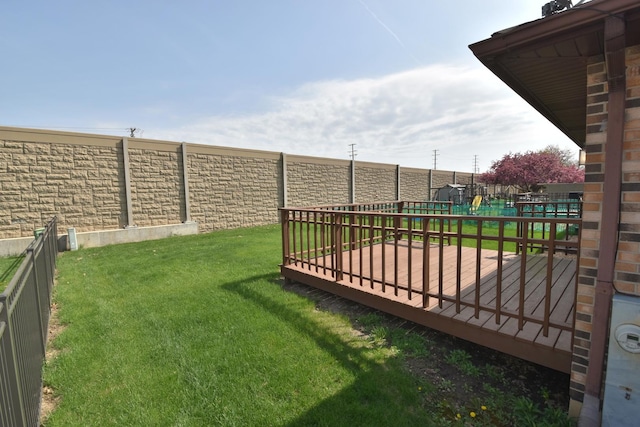 view of yard with a fenced backyard and a wooden deck