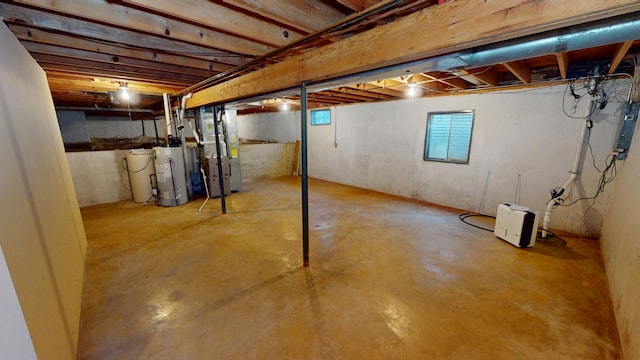 basement featuring heating unit and gas water heater