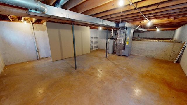 unfinished below grade area with heating unit and water heater