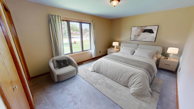 carpeted bedroom with baseboards